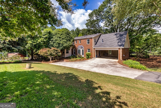 view of front facade featuring a carport and a front lawn