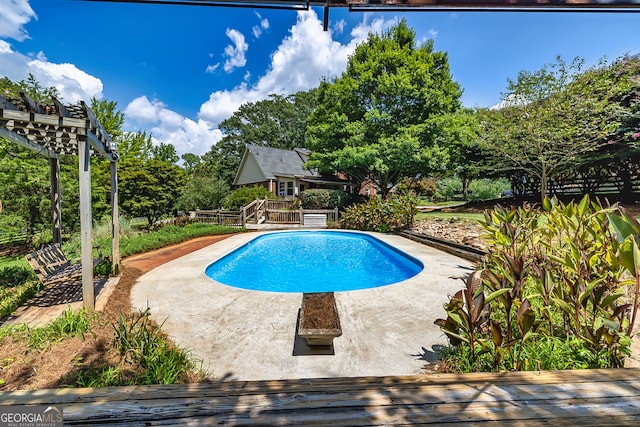 view of swimming pool with a pergola and a patio