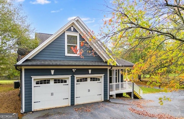 view of front of home featuring a garage and a porch