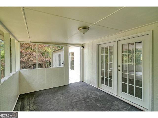 unfurnished sunroom featuring french doors