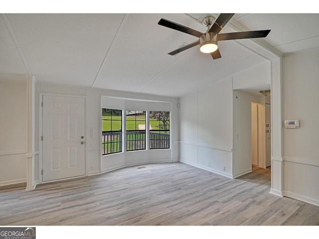 empty room with light wood-type flooring and ceiling fan