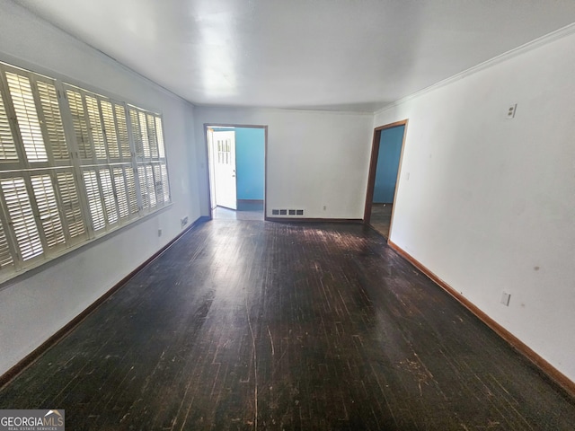 8347 Hilltop Rd, Jonesboro, GA 30236 - spare room featuring dark wood-type flooring and crown molding