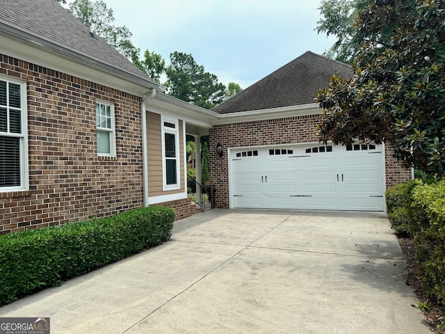 view of side of home with a garage