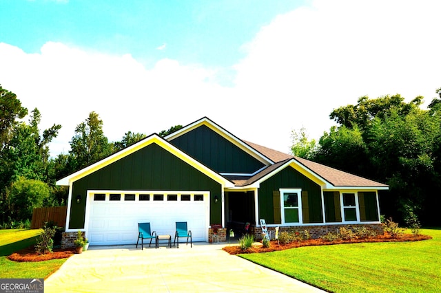 craftsman-style home featuring a garage and a front lawn