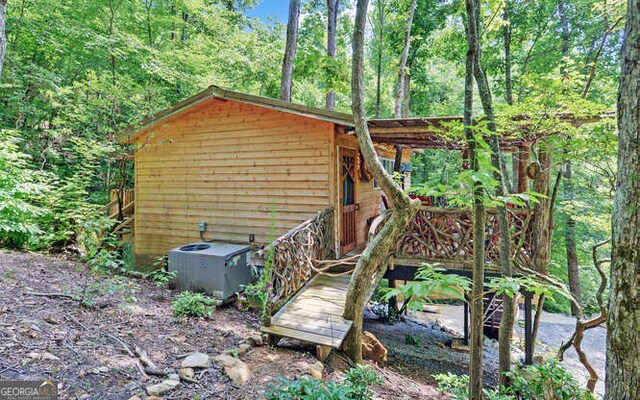 view of outbuilding featuring cooling unit