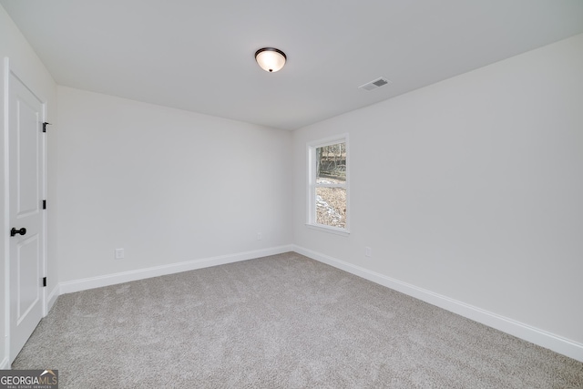 unfurnished room featuring carpet