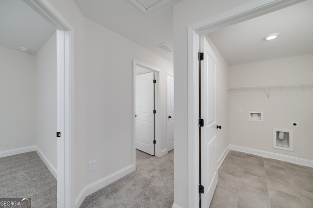 laundry area with light colored carpet, hookup for a washing machine, and electric dryer hookup