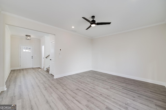 unfurnished room with ceiling fan, ornamental molding, and light wood-type flooring