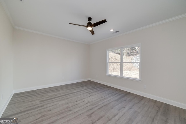 unfurnished room with ceiling fan, light hardwood / wood-style flooring, and ornamental molding