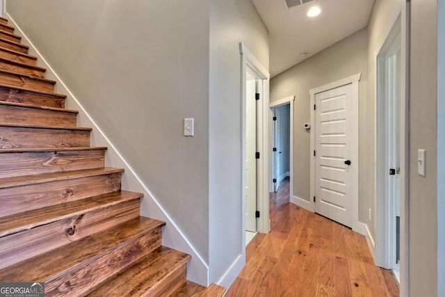 465 Wildflower Rdg, Warne, NC 28909 - stairway with baseboards, visible vents, wood finished floors, and recessed lighting