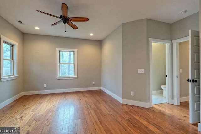 unfurnished room featuring ceiling fan and light wood-type flooring