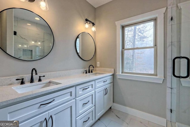 465 Wildflower Rdg, Warne, NC 28909 - full bathroom with marble finish floor, baseboards, a stall shower, and a sink
