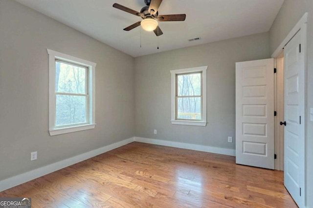 465 Wildflower Rdg, Warne, NC 28909 - unfurnished bedroom featuring visible vents, baseboards, and wood finished floors