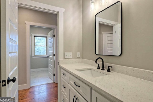 465 Wildflower Rdg, Warne, NC 28909 - bathroom featuring baseboards, wood finished floors, and vanity