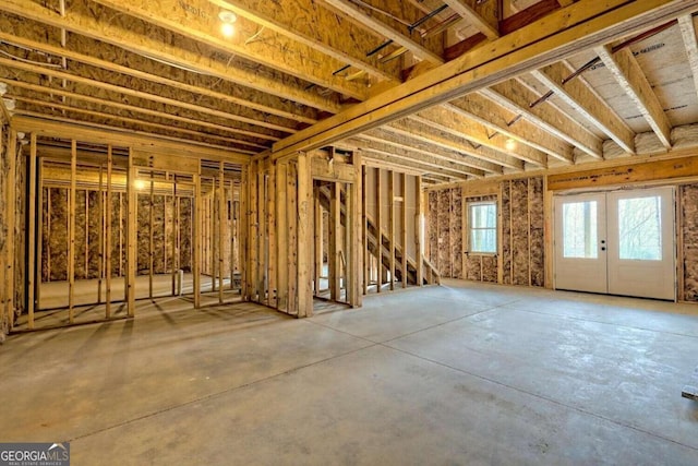 misc room featuring concrete floors and french doors