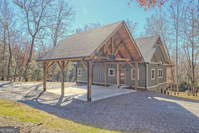 465 Wildflower Rdg, Warne, NC 28909 - exterior space with board and batten siding, a carport, and roof with shingles