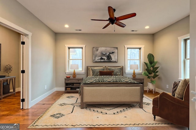 465 Wildflower Rdg, Warne, NC 28909 - bedroom featuring multiple windows, visible vents, wood finished floors, and baseboards