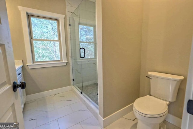 bathroom with a shower with shower door, tile patterned floors, toilet, and vanity