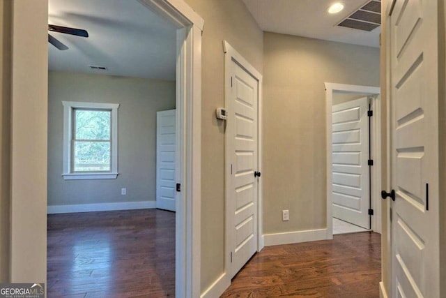 corridor featuring dark hardwood / wood-style flooring