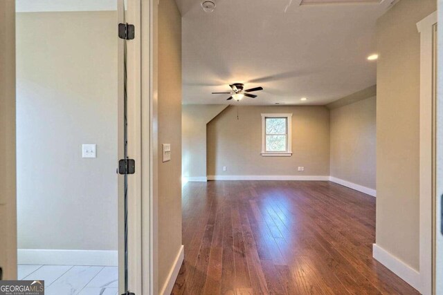 spare room with ceiling fan and hardwood / wood-style floors