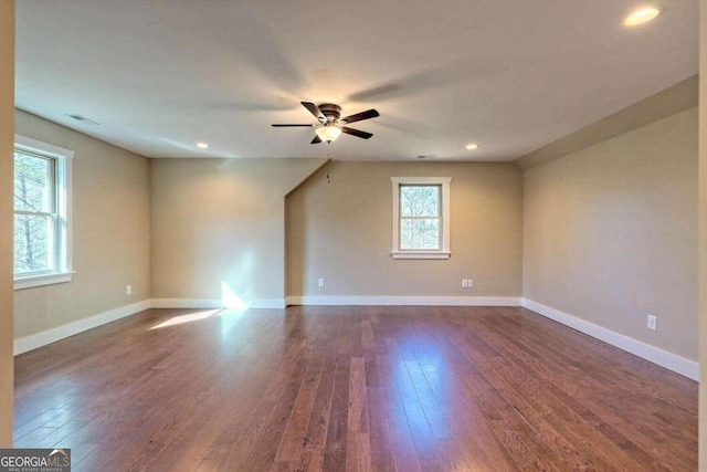 empty room featuring hardwood / wood-style floors and ceiling fan