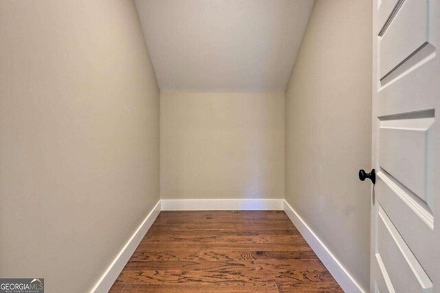 empty room with ceiling fan and hardwood / wood-style floors