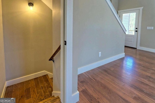 stairs with hardwood / wood-style floors