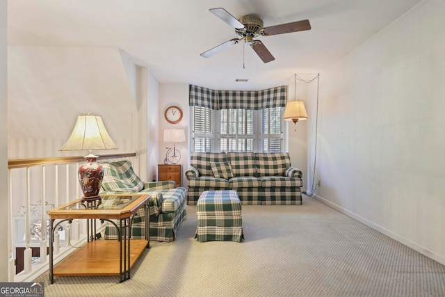 living room featuring carpet flooring and ceiling fan