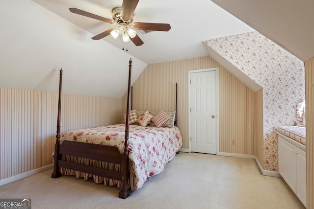 carpeted bedroom featuring lofted ceiling and ceiling fan