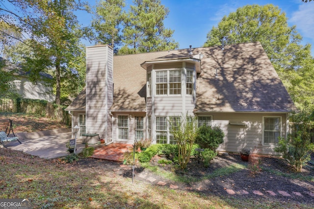 back of house with a patio