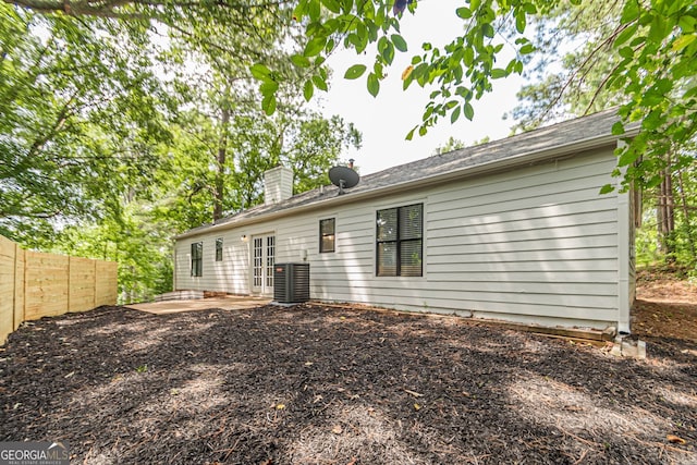 back of house with cooling unit and a patio area