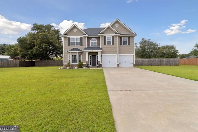 view of front of property featuring a garage and a front lawn