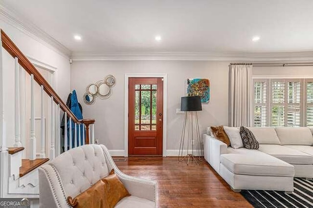 living room featuring ornamental molding and dark wood-type flooring