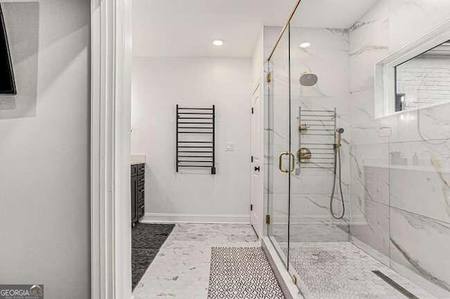 bathroom with vanity and a shower with shower door