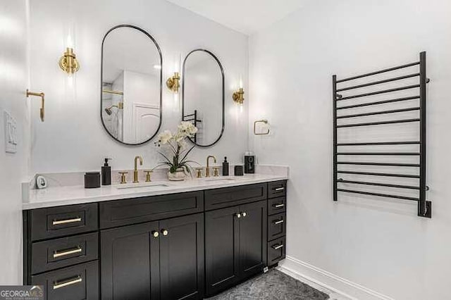 bathroom with radiator heating unit and vanity