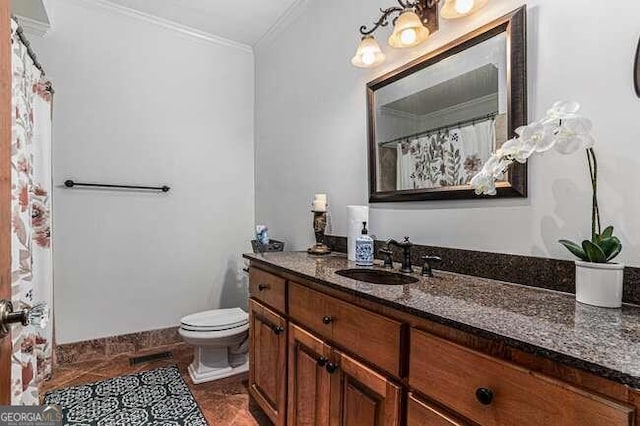 bathroom with tile patterned floors, vanity, toilet, and ornamental molding