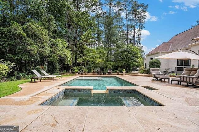 view of swimming pool featuring an in ground hot tub, an outdoor living space, and a patio