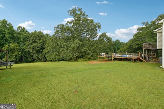 view of yard featuring a wooden deck