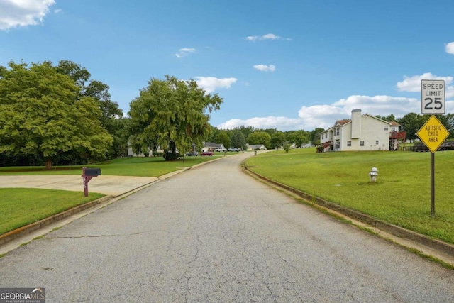 view of street featuring curbs and traffic signs