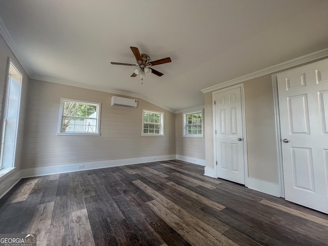 unfurnished bedroom featuring dark hardwood / wood-style flooring, multiple windows, ornamental molding, and a wall mounted AC