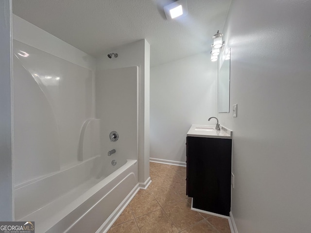 bathroom featuring vanity, tile patterned flooring, shower / washtub combination, and a textured ceiling