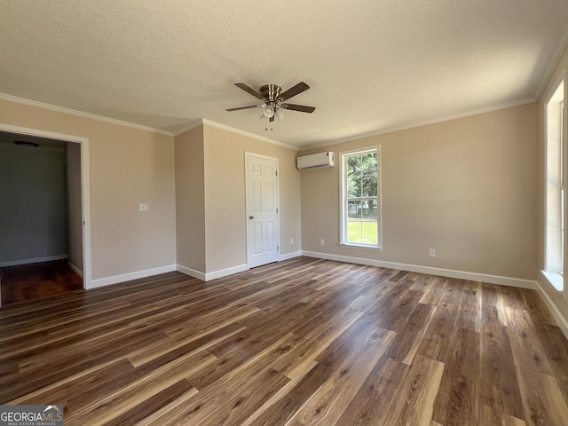 unfurnished room featuring dark hardwood / wood-style floors, a wall mounted AC, ceiling fan, crown molding, and a textured ceiling