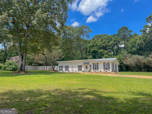 ranch-style house with a front lawn