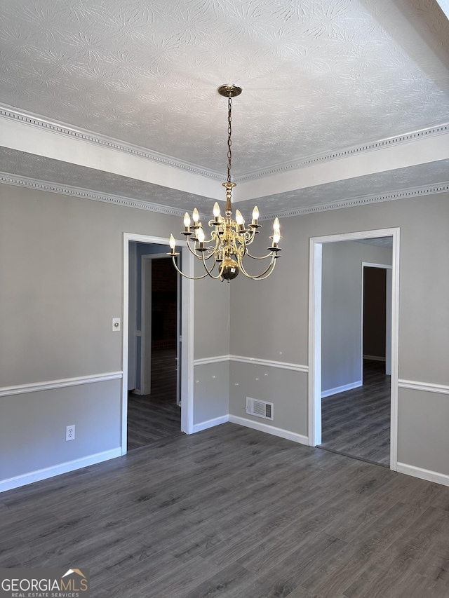 unfurnished room featuring dark wood finished floors, visible vents, and baseboards