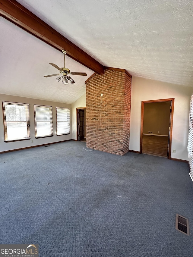 unfurnished living room with carpet floors, visible vents, lofted ceiling with beams, and a textured ceiling