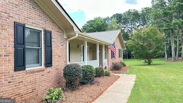 view of property exterior featuring a yard and a porch