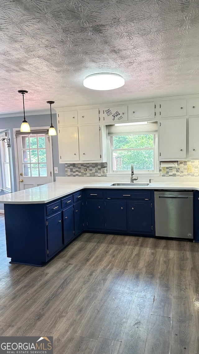 kitchen featuring a healthy amount of sunlight, dishwasher, white cabinetry, and sink