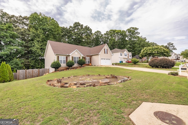 view of front of home with a garage and a front yard