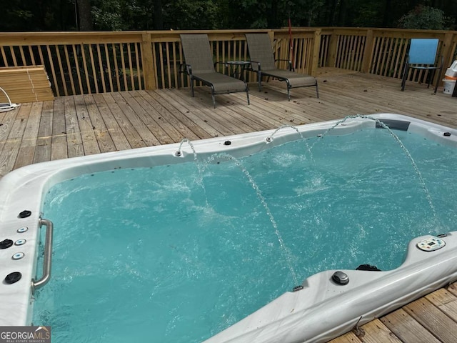 view of pool with a deck