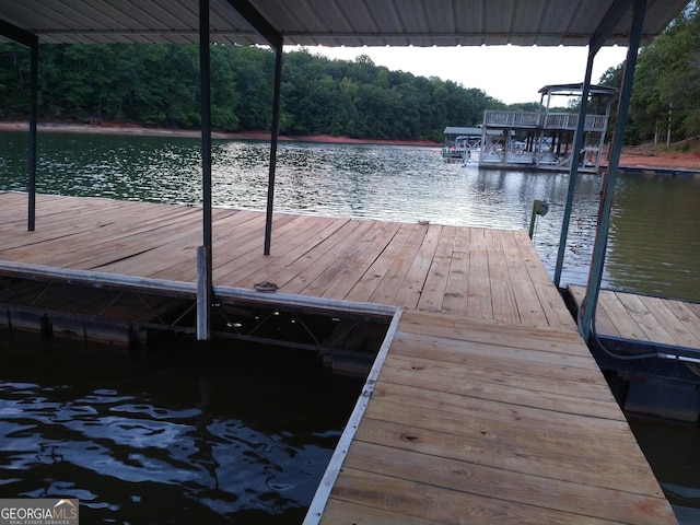 dock area featuring a water view